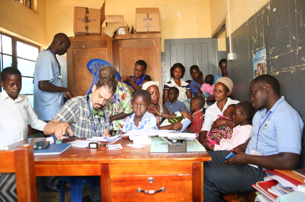 A VOLUNTEER MEDIC TREATING PATIENTS